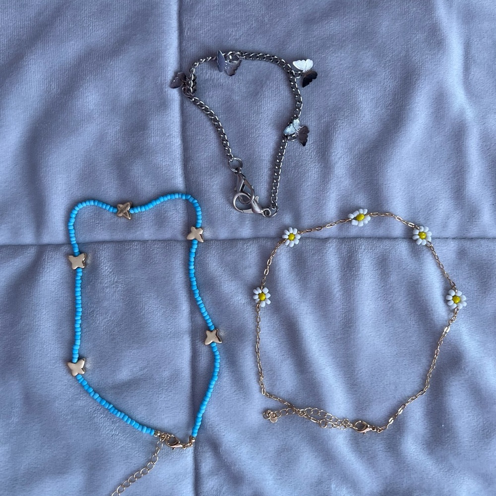 necklaces, and a silver anklet chain